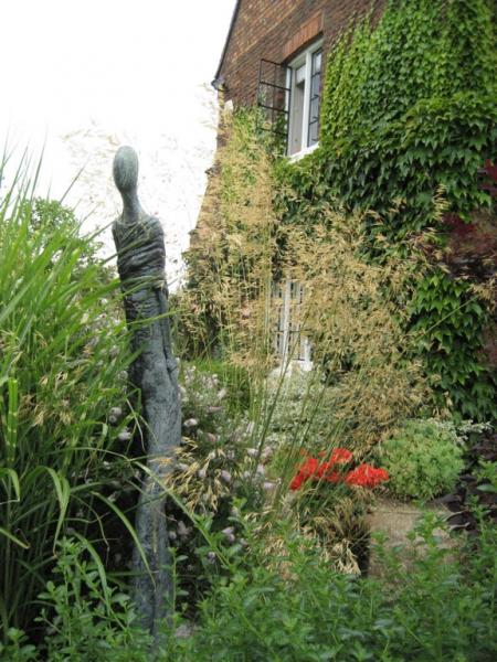 Bespoke sculpture amongst bed of mixed grasses